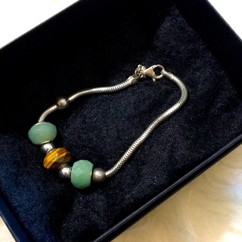 Sterling silver charm bracelet w precious stones. 8”